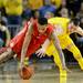 Ohio State sophomore Laquinton Ross and Michigan freshman Nik Stauskas chase after the ball during the first half at Crisler Center on Tuesday, Feb. 5. Melanie Maxwell I AnnArbor.com